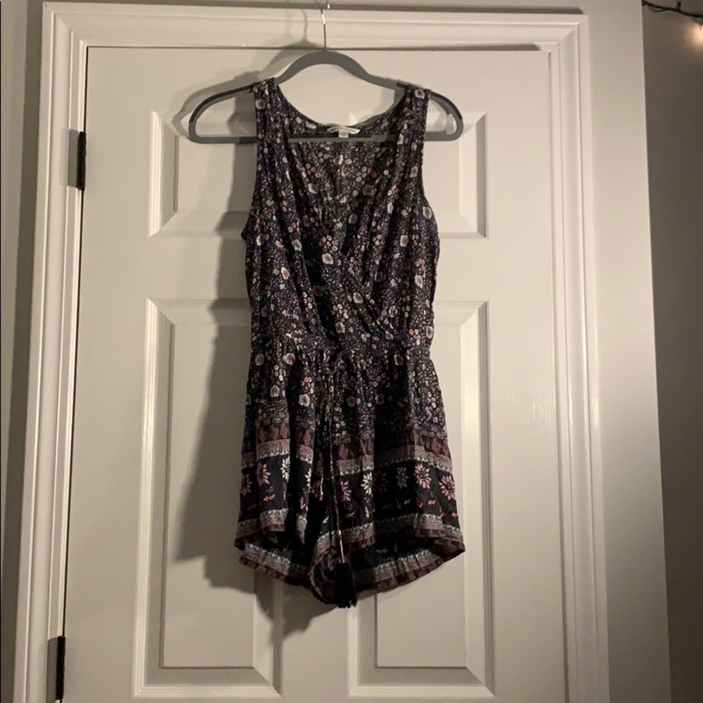 flower patterned romper with a tie string.